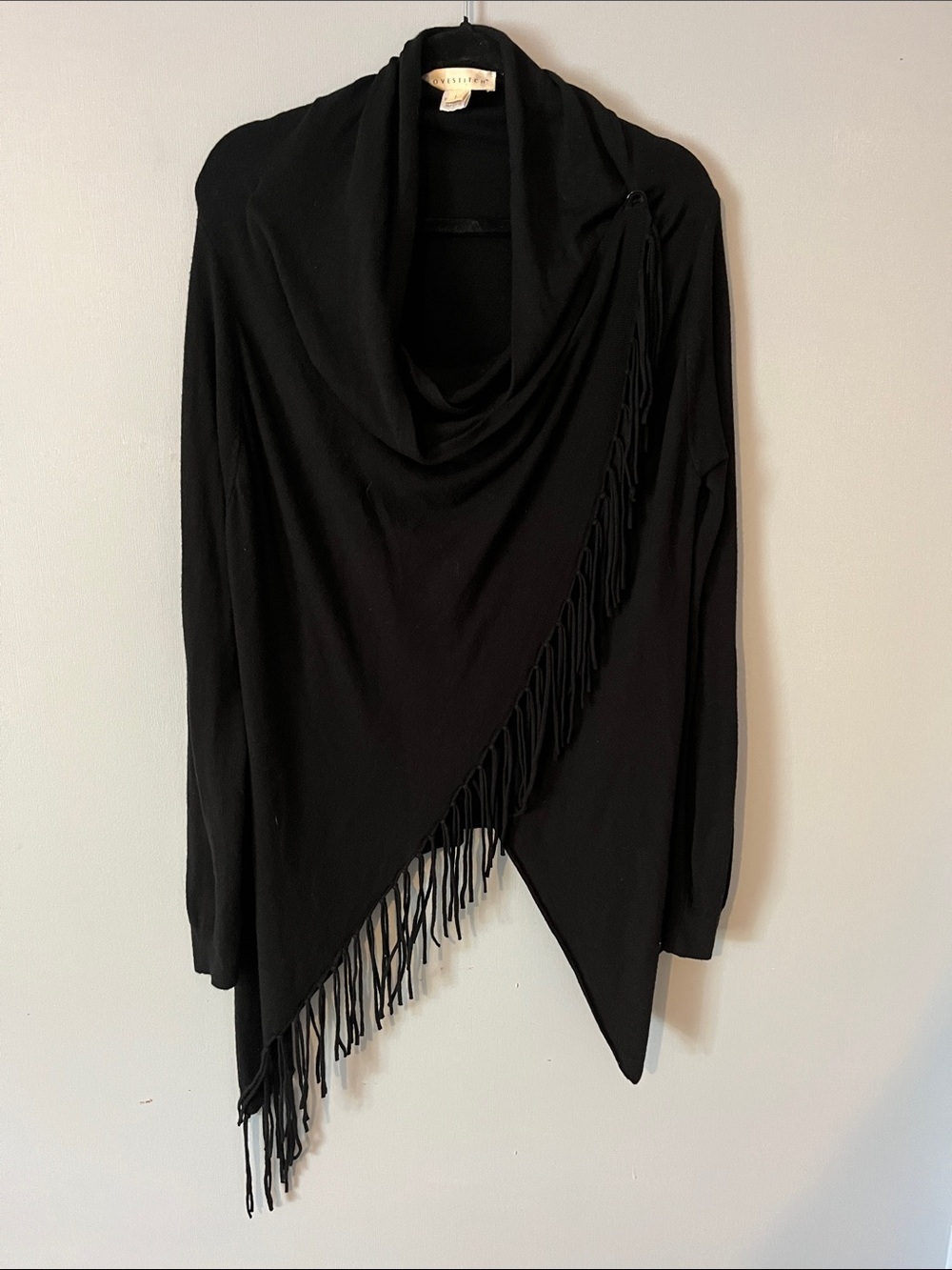Sweater cape with fringe